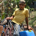 Close-up of boy carrying water on his horse - Joven cargando agua en su caballo; Pombote, Nicaragua