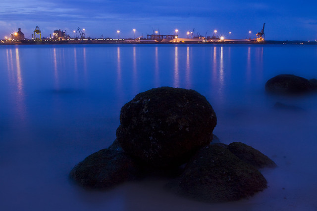 Punggol Beach, Singapore - Lonely rocks facing the harbour of Malaysia