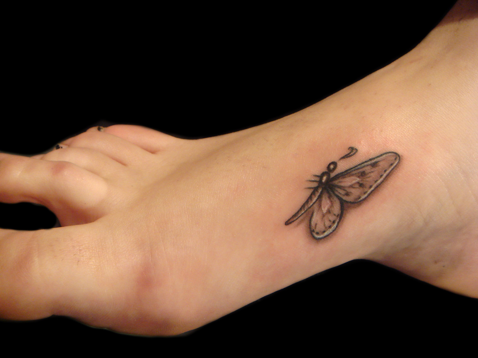 Small butterfly tattoos on foot