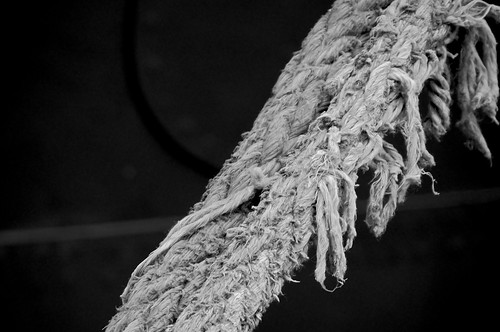 Frayed photo by Colin Nederkoorn on Flickr: black and white close-up of a section of fraying rope