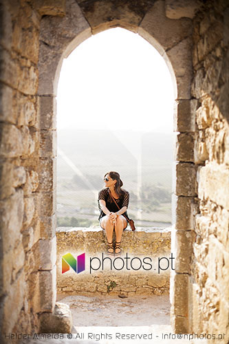 Woman walking at Óbidos castle wall