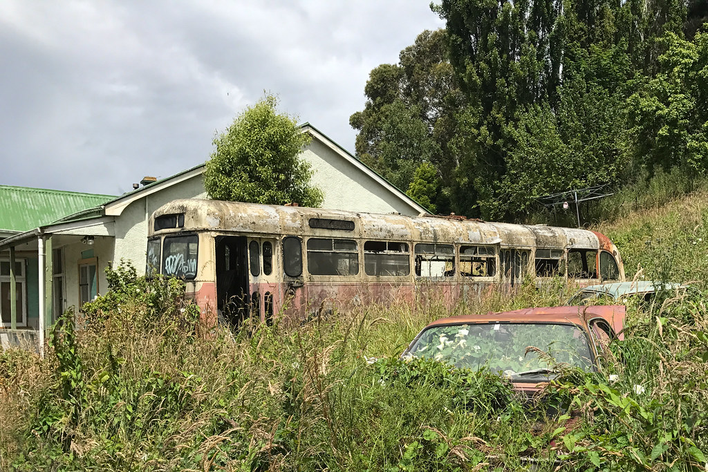 Abandoned cars; bus; and house, Dunedin, New Zealand