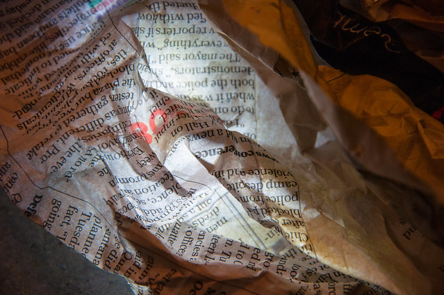 newspaper, lit from behind