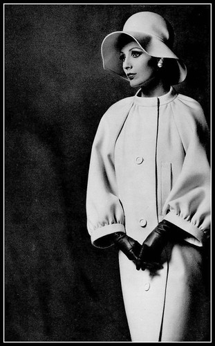 Model in ivory velvet-wool coat with raglan sleeves and ba… | Flickr