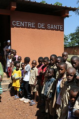 Children greet UNICEF at the local health clinic