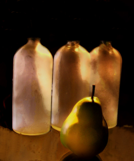 three bottles and a pear