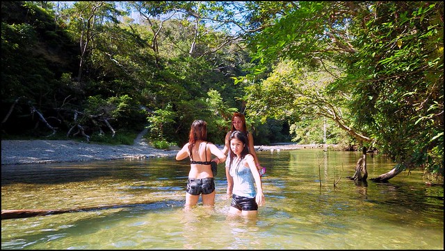 THREE GIRLS IN A RIVER -- Filipina Band Members Cooling Off in the Jungles of Okinawa