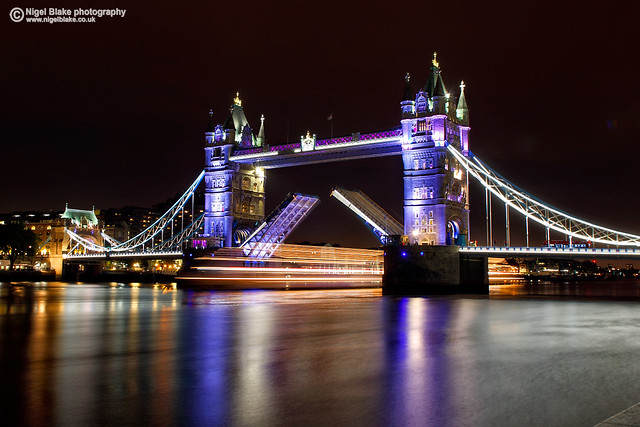 Tower Bridge, open for a boat, London UK