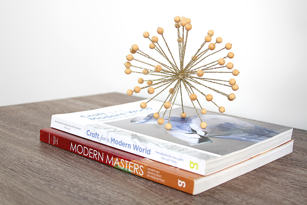 Coffee table books with gold orb