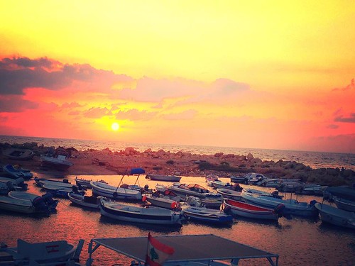 sunset sea sky lebanon sun yellow clouds boats flag mina tripoli elmina