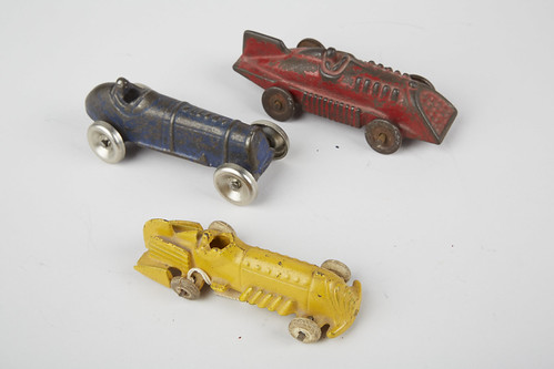70 Lot of 3 - Hubley Cast-Iron Small Toy Race Cars w/ Attached Drivers:  1 - red w/ fin, slanted front grille, 1 - yellow w/ fin, exhaust stacks, rubber tires & 1 - blue "AUSTIN" embossed on hood, all look to be in original condition - each approx. 4"l | by victoriancasinoantiques
