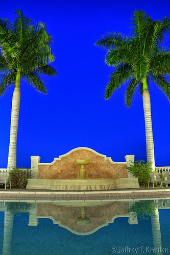 blue sky reflection green fountain pool sunrise dawn florida resort palmtree westin capecoral marinavillage
