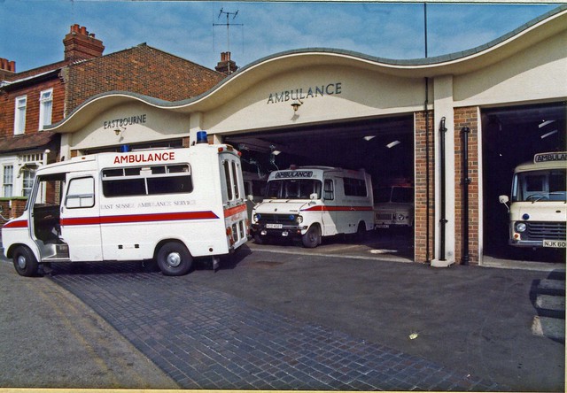 Eastbourne Ambulance Station in1980 showing Bedford CF Hanlons on left and previous Wadham Stringer on the right. Eastbourne 'Major', Bedford J Series Major Incident Vehicle inside garage.