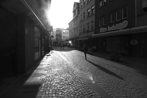Alone towards the Sun by Lord Demise, The low light of the setting sun filled the streets of Koblenz, near Münzplatz.street city light sun