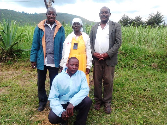 Mark Lilungo Wecheta, Mama  Maria Wecheta, Solomon Malova Okwili and Albert Inima on the shamba at Tombo Village