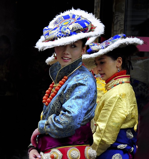 Tibetan woman wearing traditional hat of lamb fur, Tibet 2013