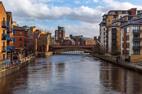 city bridge people reflection water clouds buildings river cityscape yorkshire leeds flats scenary aire towpath