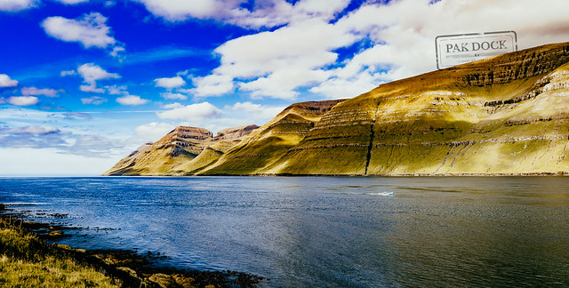 A man fishing in the fjord of Kunoy (panorama) - Faroe Islands