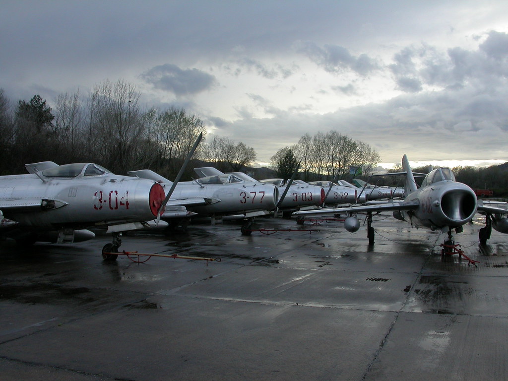 Line of Shenyang F-6/MiG-19S's being; 3-04 c/n 1304, 3-77 c/n 7117, MiG-19S 3-03 c/n 1303, 3-72 c/n 7912, 3-74 c/n 7114 and 3-34 c/n 3304.  To the right is Shenyang FT-5 8-08 c/n 551308. ex Albanian-AF. (Stored Tirana-Rinas, 14-03-2013)