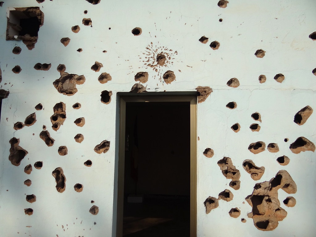 Munitions-Riddled Facade of Room Where Belgian Peacekeepers Were Murdered - Former Camp Kigali - Kigali - Rwanda - 01