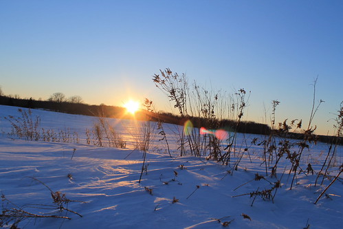 Sunset by Gtownrailfan, over a frozen field. CN's West Bend line is behind me.