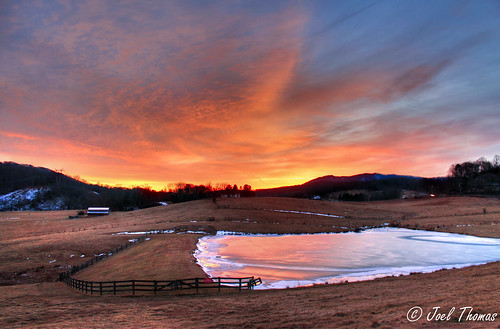 winter sunset mountains cold ice water clouds frozen pond farm january