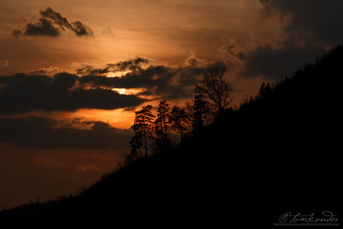 sunset countryside austria burgenland mountains trees clouds forest sun orange golden dark