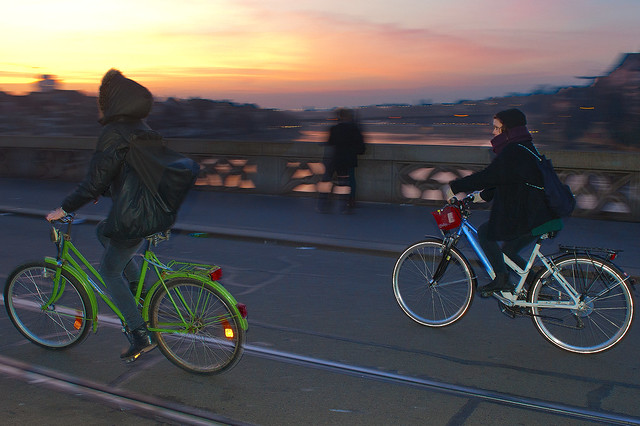 Sunrise in Basel ,March 10. 2014.  2 girls riding their bicycle . No. 4877A.