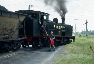 SMR30 and the Neath Junction signal man exchange staffs as the train leaves the Neath Colliery Branch for the Main Line. South Maitland Railways, NSW, January, 1979.