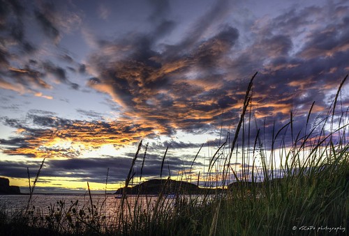 sunset water ocean sky clouds blue orange red green island grass twillingate newfoundland labrador canada outdoor landscape seascape canon