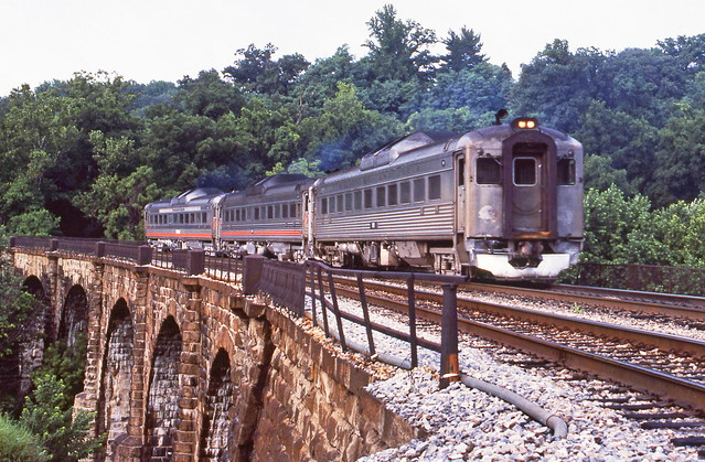 Maryland Area Rail Commuter (MARC) RDC's are seen on the Thomas Viaduct as the train heads west along the double track CSX mainline (originally B&O) to the suburbs, Maryland, August 1988