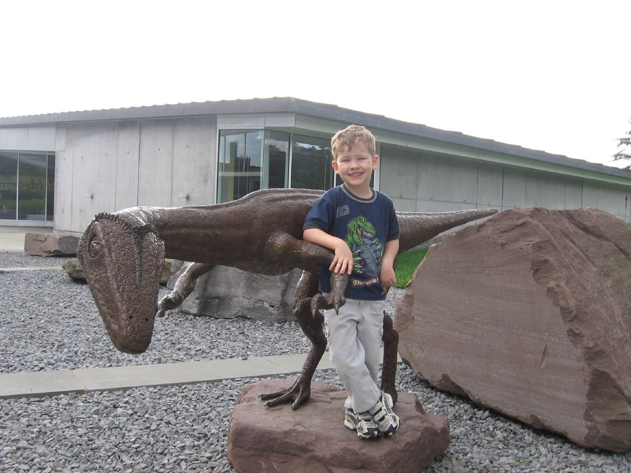 Dinosaur and Kid. Photo by howderfamily.com; (CC BY-NC-SA 2.0)