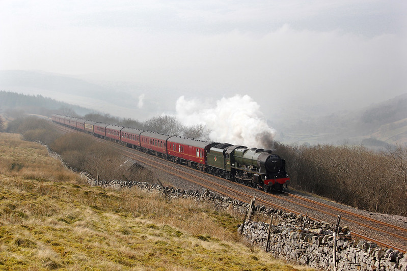 On a hazy Spring day, 46115 'Scots Guardsman' heads 'The Hadrian' high up on the fellside of Garsdale, having just emerged from Risehill Tunnel.