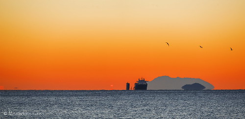 Cargo ship at sunrise by Mavroudakis Fotis, A heavy lift cargo ship in the gulf of Kavala in Greece.
ocean sunset red sea lighthouse industry wa
