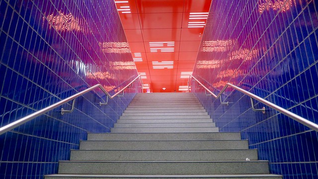 Munich after sunset: red, white and blue in an underground station.