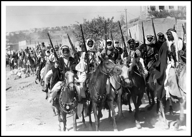 Emir Saud's ( later King Saud of Saudi Arabia ) visit to Emir Abdullah in Amman. Bedouin cavalcade riding through streets of Amman - 1935 Aug. 17.