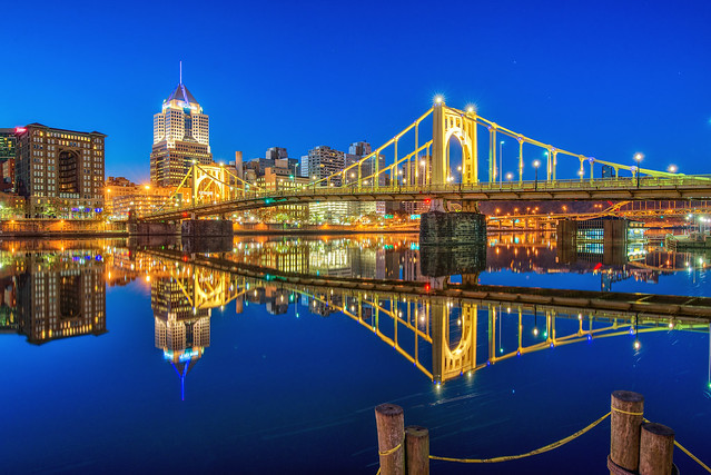 The Roberto Clemente Bridge reflects in the Allegheny River in Pittsburgh during the morning blue hour HDR