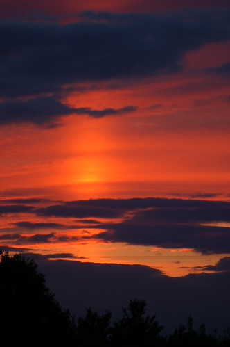 The colourful evening sky by Kirkleyjohn, The sun has set but a bright patch appears in the sky above.sunset clouds evening suffolk sunsetligh