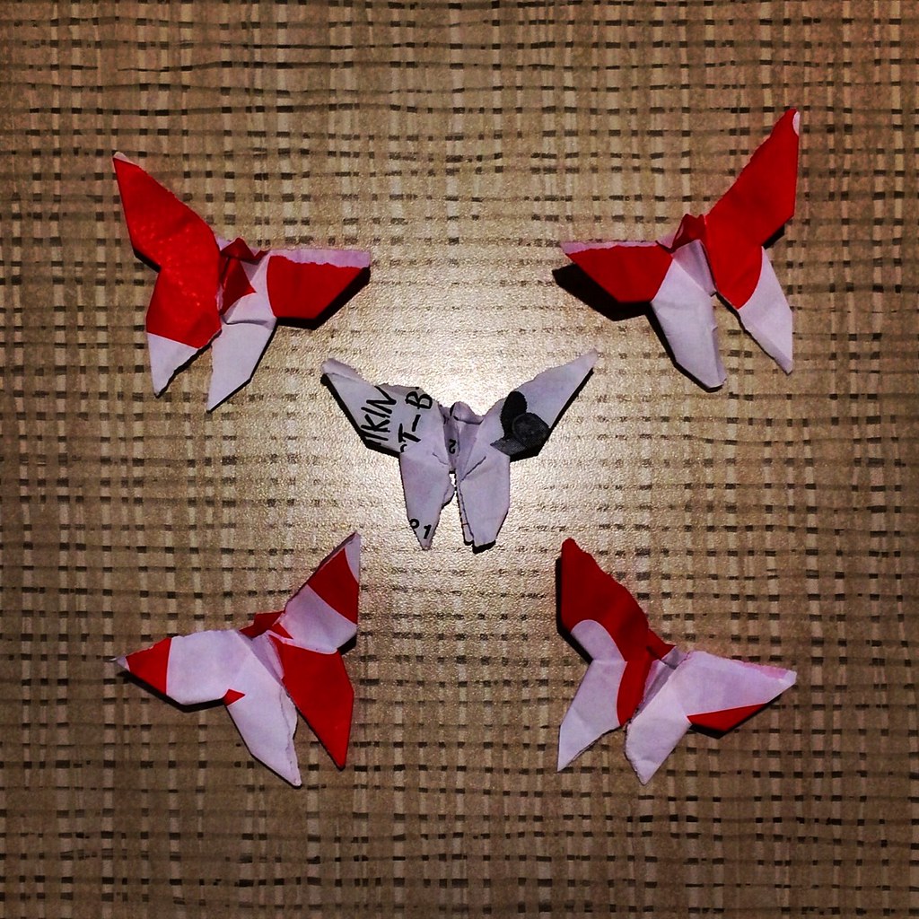 Butterfly origami of red patterns fly around @chikfila #fastfoodorigami