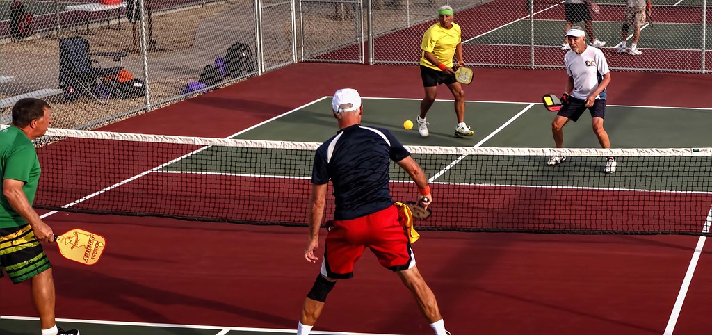 Grand Canyon 2014 Pickleball Tournament - a group of people playing tennis on a court