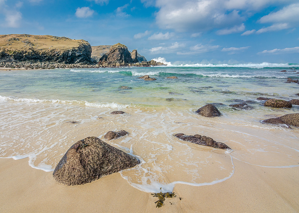 Surf breaking on an empty beach — via Openverse (Christopher Combe Photography, CC BY)