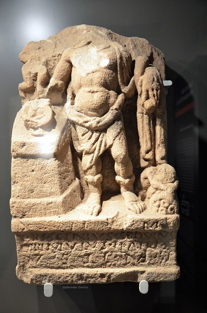 Sandstone relief of a Genius holding a patera with offerings over an altar and in his left hand and a cornucopia, found in the pit of the Mithras sanctuary, Museum Schloss Fechenbach, Dieburg, Germany