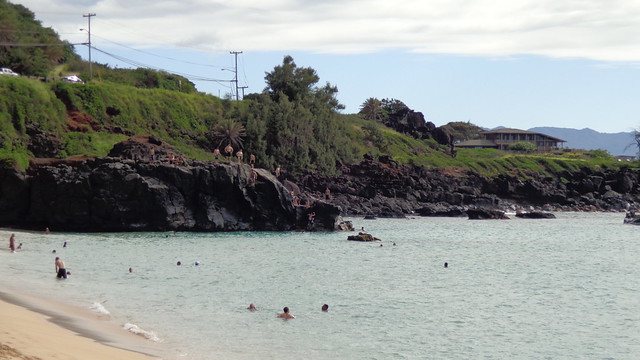 Jumping off the rocks at Waimea Bay.