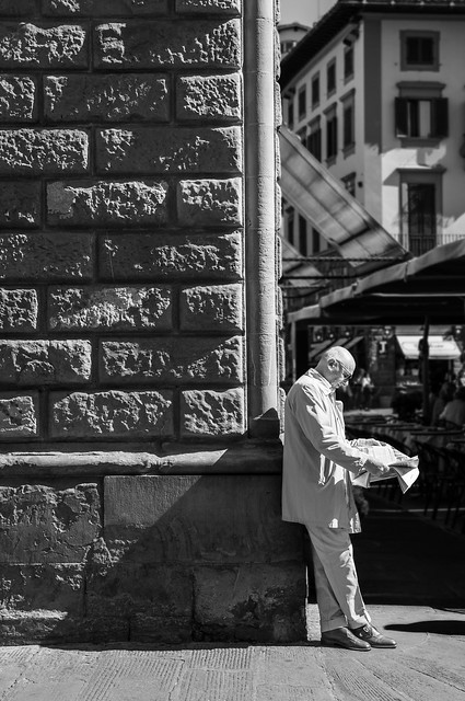 Man reading a paper - Firenze, Italy