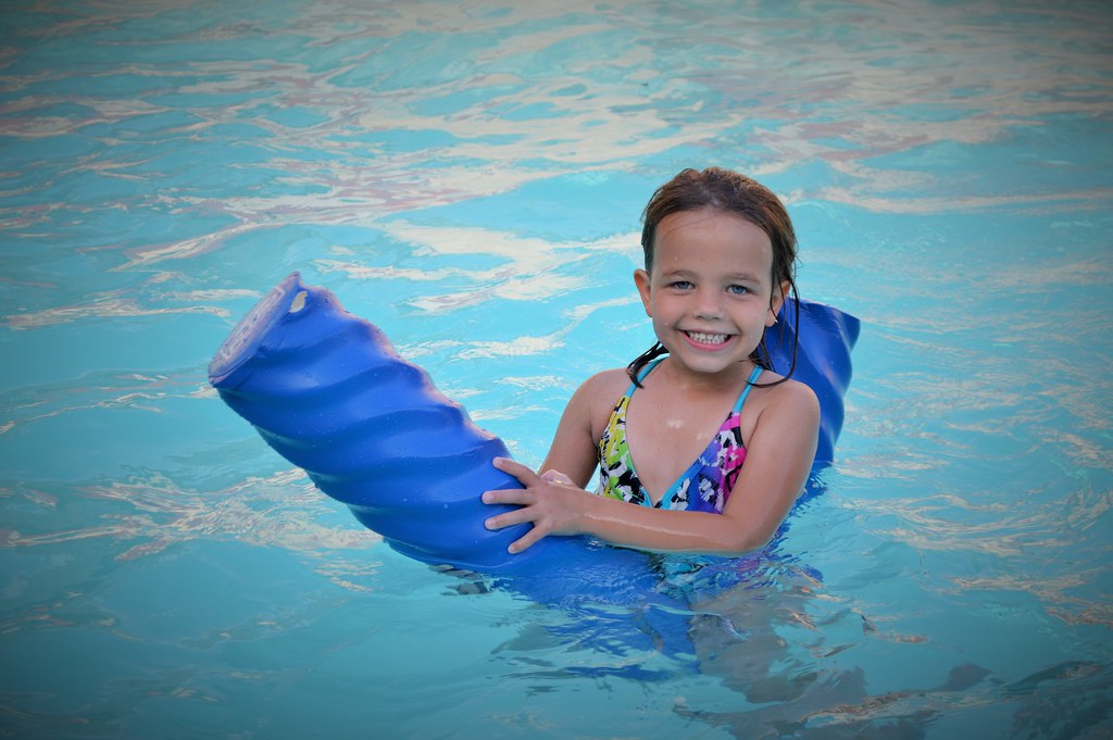 Kid having fun in hotel pool