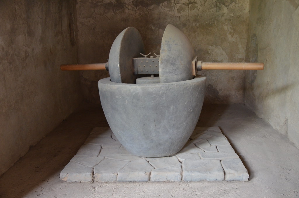 An olive crusher displayed in the House of the Ship Europa, Pompeii