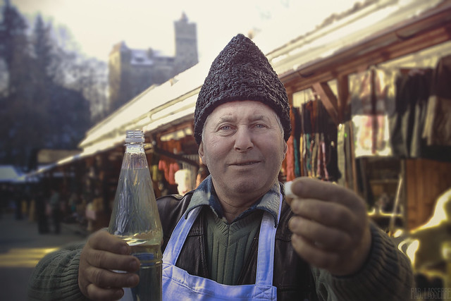 Radu, street vendor of Palinka (Alcohol) and cheese - Bran Castle, Romania - 2010, January