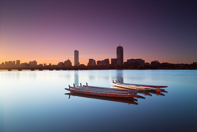 Hazy Sunrise over Dragon Boats on Charles River with Boston Skyline, Back Bay, and Harvard Bridge - Cambridge, MA USA