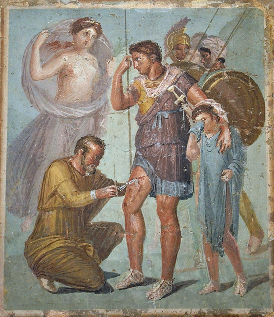 Fresco depicting Iapyx removing an arrowhead from Aeneas' thigh in the presence of Venus stands and Aeneas' young son Ascanius, from Pompeii, Naples National Archaeological Museum