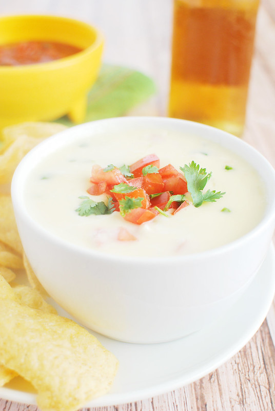 Restaurant Style Queso Dip - just like your favorite Mexican restaurant! Spicy melted cheese - perfect for dipping tortilla chips or using as a topping for tacos or burritos!